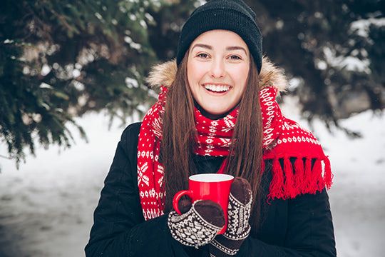 Woman is happy in the snow